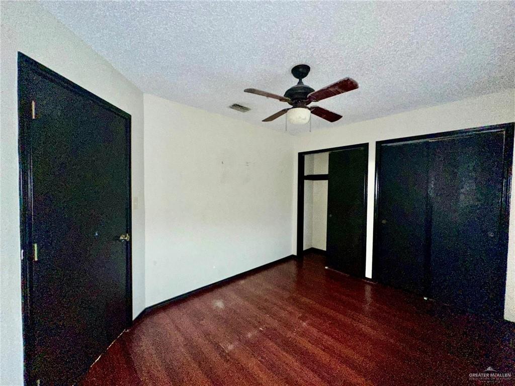 2109 Umar Avenue McAllen, TX 78504 - Photo 25 of 25 a view of room with hardwood floor and a ceiling fan