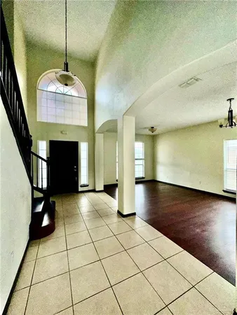 a view of an empty room with a fireplace