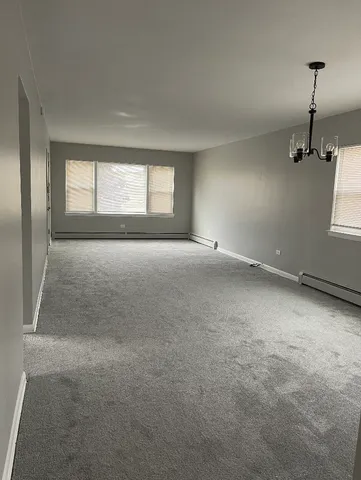 a view of empty room with windows