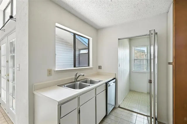 a kitchen that has a sink and a window