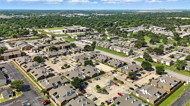 an aerial view of a house with a swimming pool