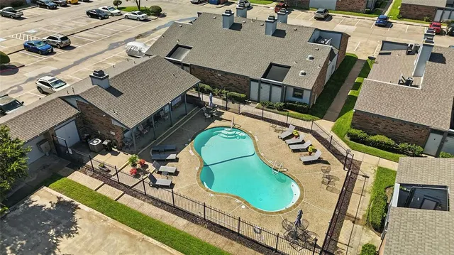 an aerial view of a house with a garden