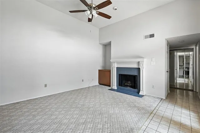 wooden floor fireplace and windows in a room