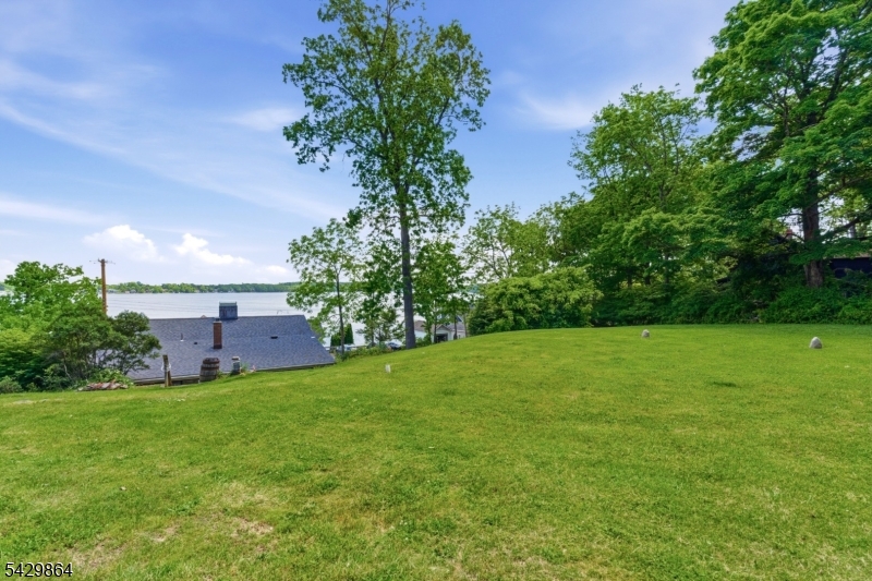 77 Lower North Shore Road Branchville, NJ 07826 - Photo 26 of 38 a view of a garden with a house