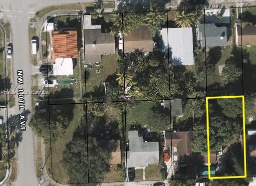 0 Th Miami, FL 33150 - Photo 2 of 2 a bathroom with a glass shower door and a mirror