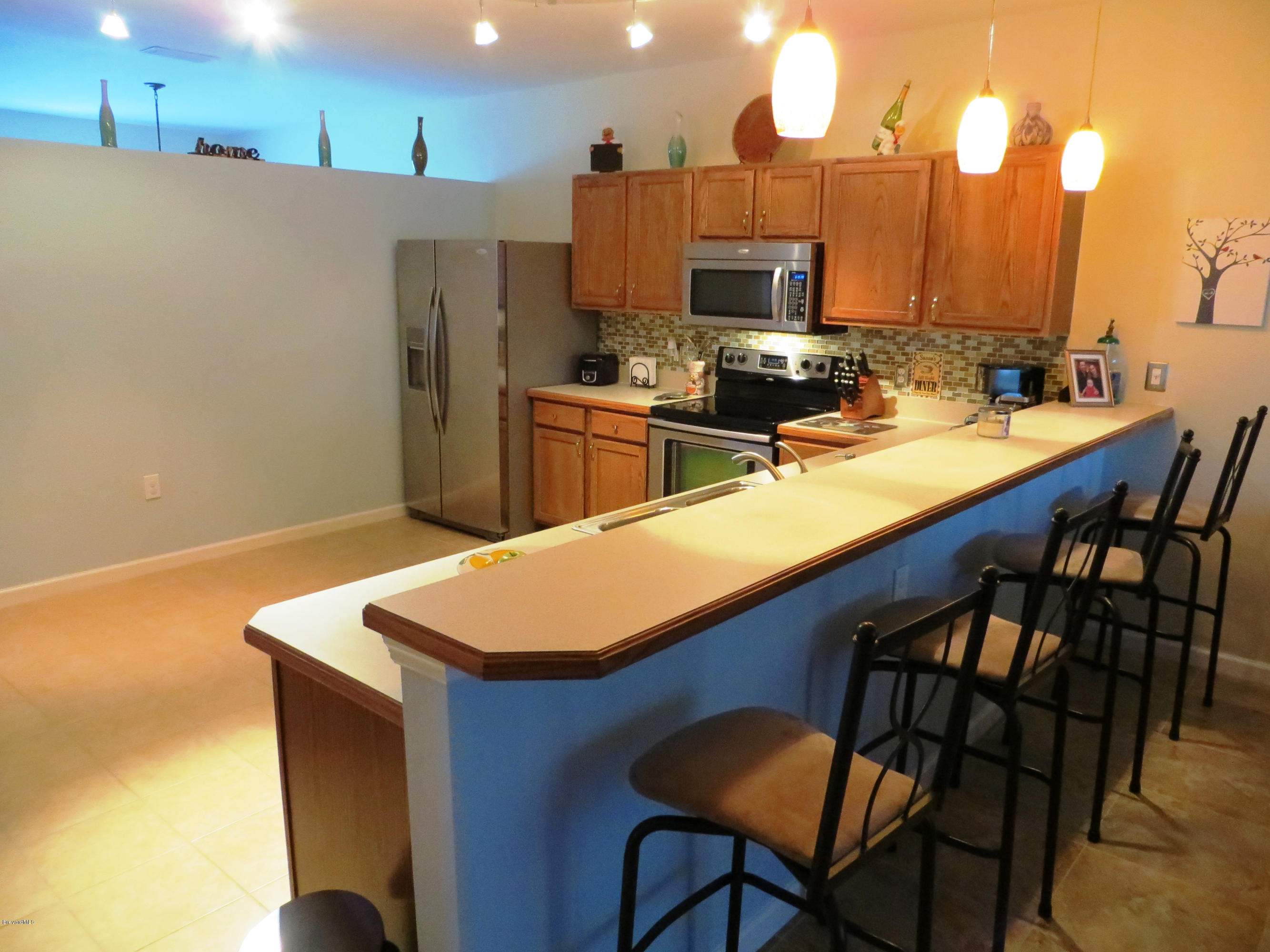 1295 Gerry Road Southwest Palm Bay, FL 32908 - Photo 9 of 28 Oversized step up breakfast bar