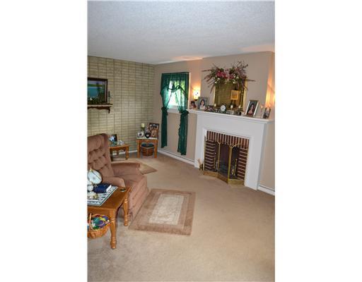 1535 Baldwick Road Pittsburgh, PA 15205 - Photo 3 of 13 Living Room. Neutral plush carpeting and freshly painted neutral walls in the living room with decorative fireplace and accent lighting.