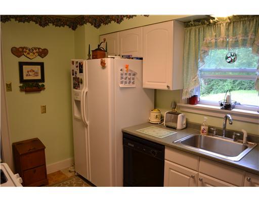 1535 Baldwick Road Pittsburgh, PA 15205 - Photo 5 of 13 Kitchen. Fully equipped Updated kitchen with white cabinetry and access to 24x 15 enclosed porch with double sliding doors.
