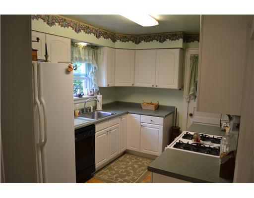 1535 Baldwick Road Pittsburgh, PA 15205 - Photo 6 of 13 Kitchen. Kitchen is complete with dishwasher, side by side refrigerator and gas stove. The updated white cabinetry provide great storage and ample counterspace.