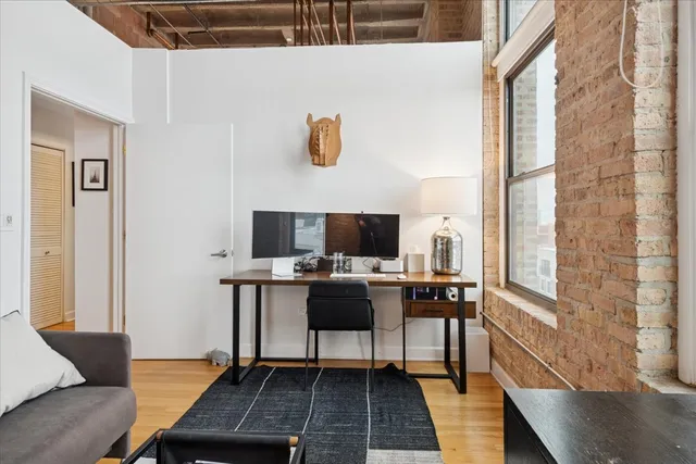 a work room with furniture and a window