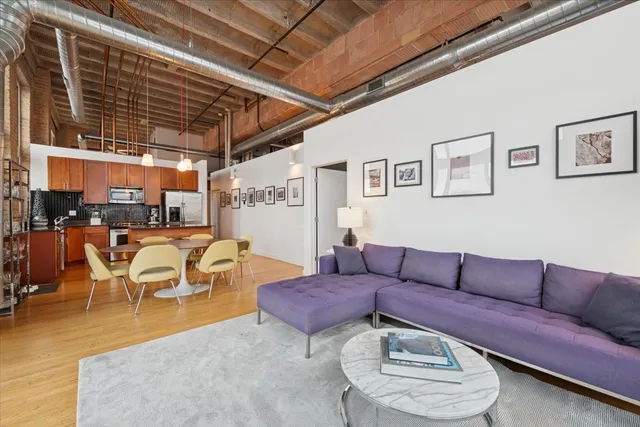 a living room with lots of furniture and a rug