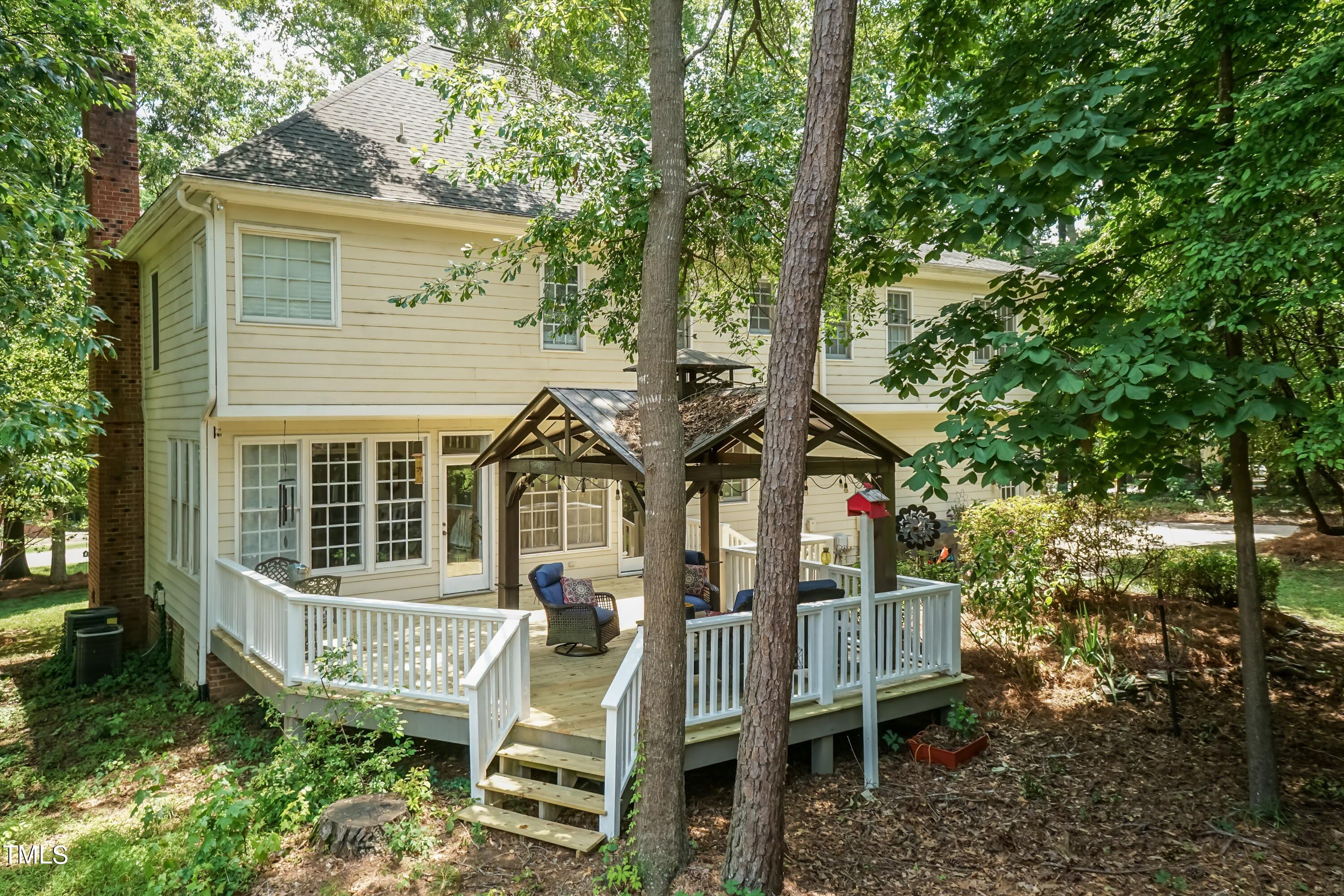 4112 Ridgebrook Bluffs Drive Raleigh, NC 27603 - Photo 4 of 40 Semi Private backyard with large deck and covered area.