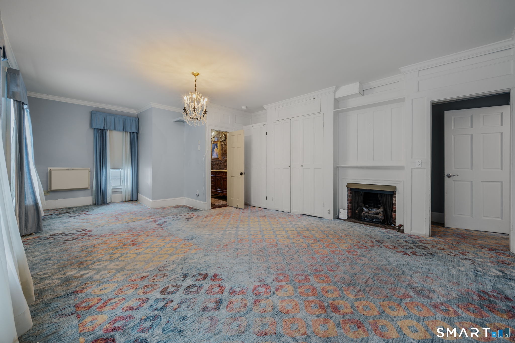 9 Lyme Street, Unit 2 Old Lyme, CT 06371 - Photo 13 of 29 a view of empty room with a fireplace