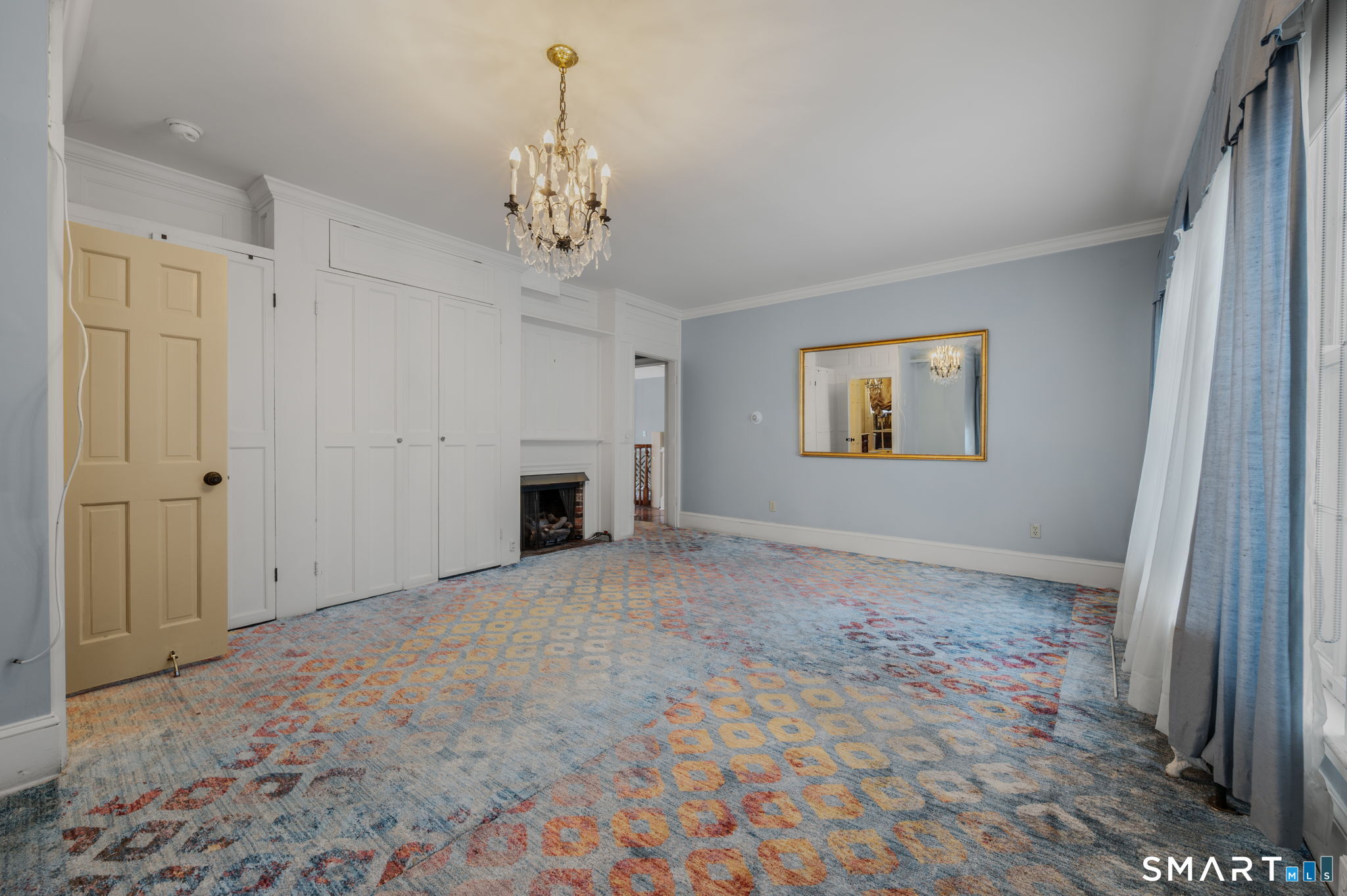 9 Lyme Street, Unit 2 Old Lyme, CT 06371 - Photo 14 of 29 en empty room with windows and fireplace