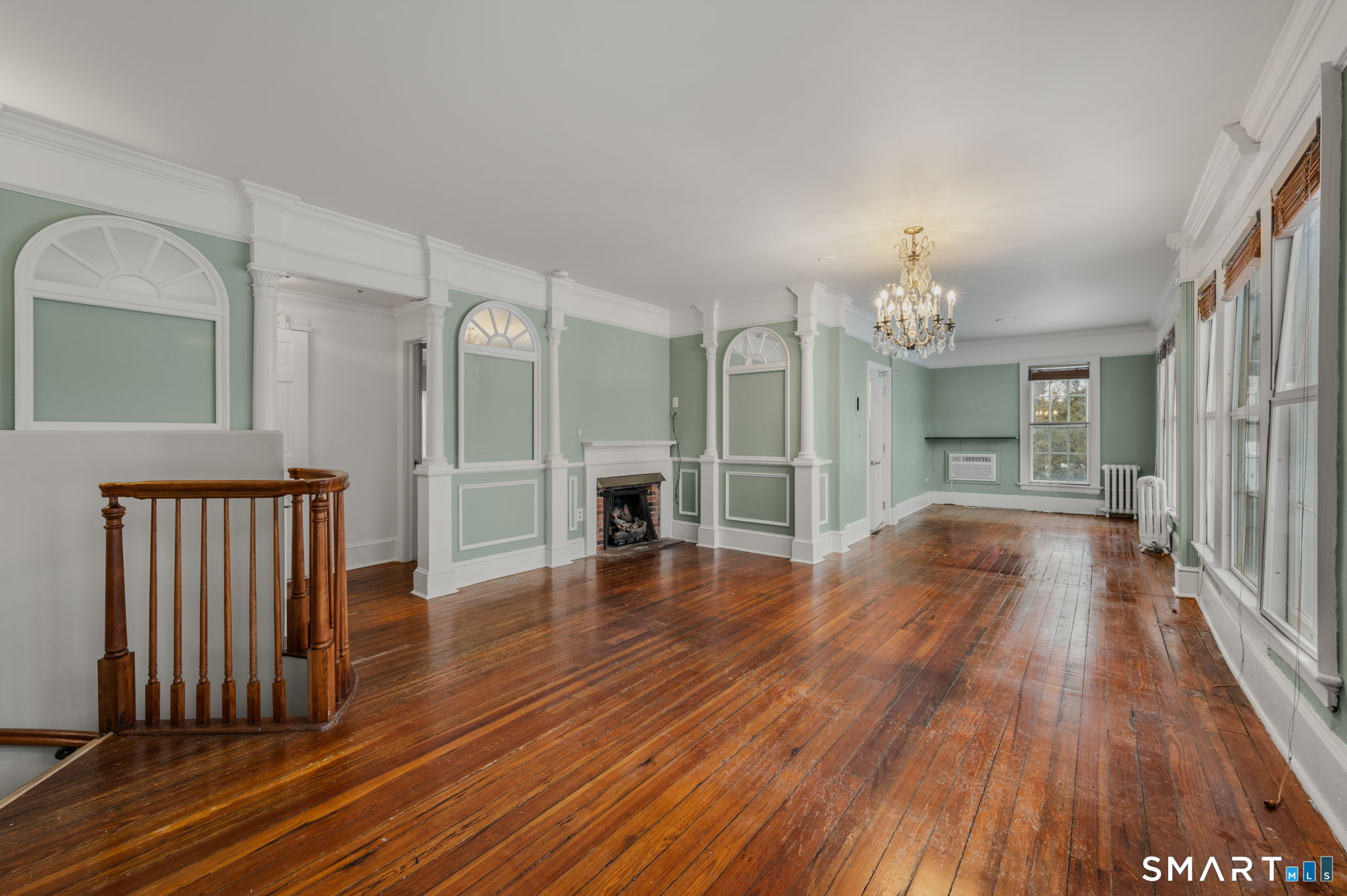 9 Lyme Street, Unit 2 Old Lyme, CT 06371 - Photo 16 of 29 a view of a room with wooden floor and staircase