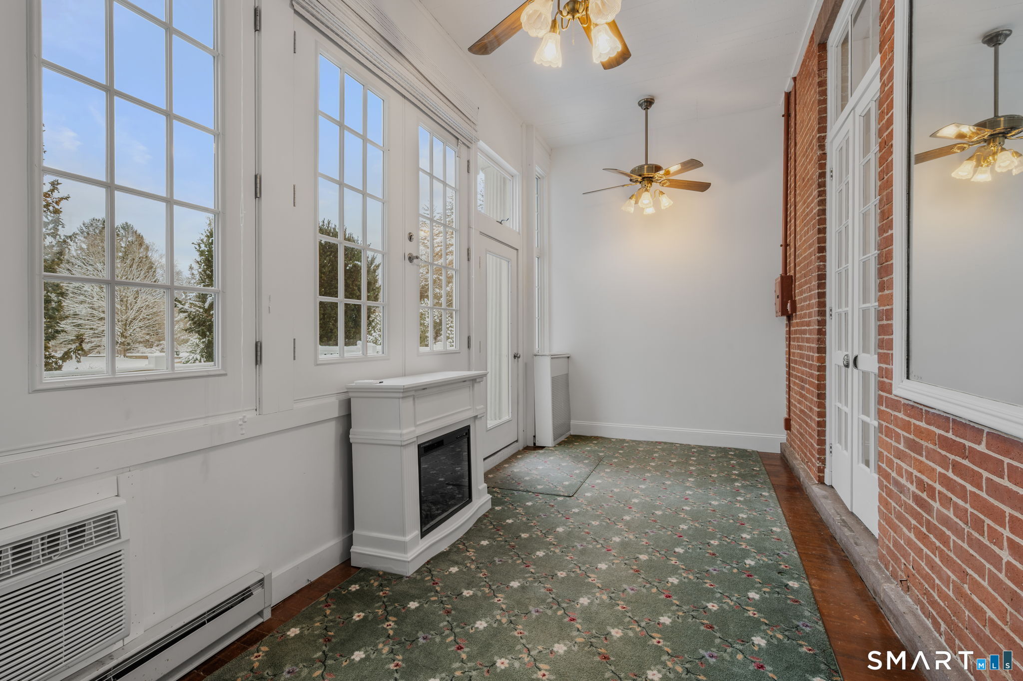 9 Lyme Street, Unit 2 Old Lyme, CT 06371 - Photo 22 of 29 an empty room with windows