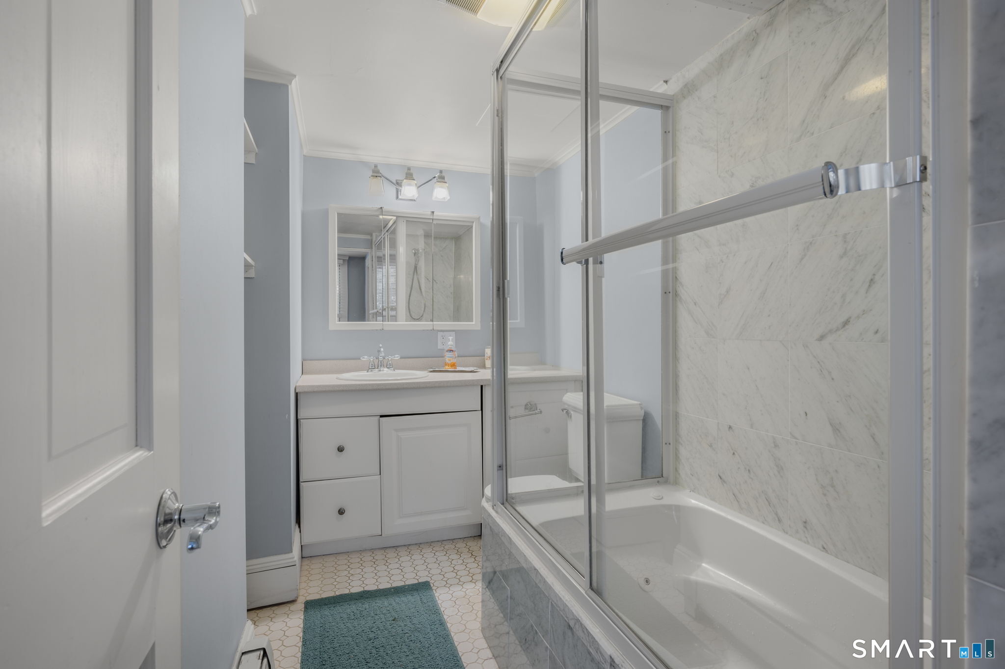 9 Lyme Street, Unit 2 Old Lyme, CT 06371 - Photo 29 of 29 a bathroom with a bathtub and a shower