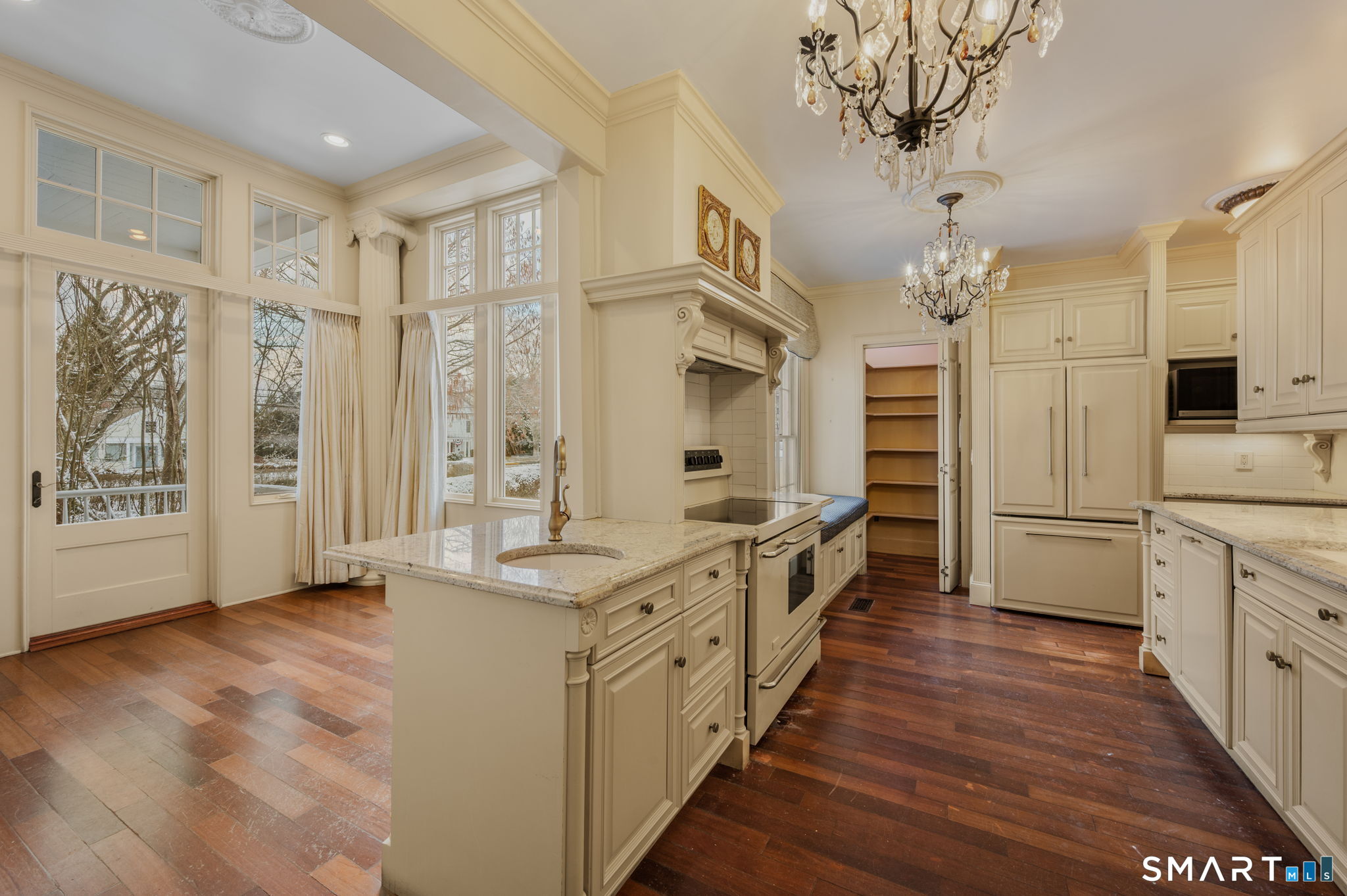 9 Lyme Street, Unit 2 Old Lyme, CT 06371 - Photo 6 of 29 a large white kitchen with a large window