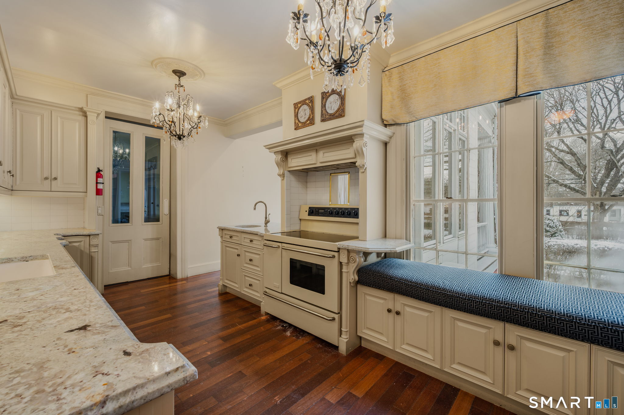 9 Lyme Street, Unit 2 Old Lyme, CT 06371 - Photo 8 of 29 a kitchen with stainless steel appliances a stove a sink and a refrigerator