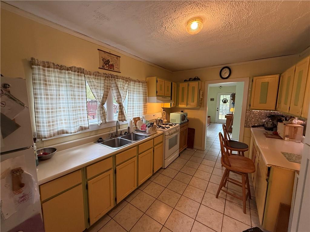 111 Fulton Lane Indiana, PA 15701 - Photo 5 of 20 a kitchen with stainless steel appliances a sink stove and cabinets