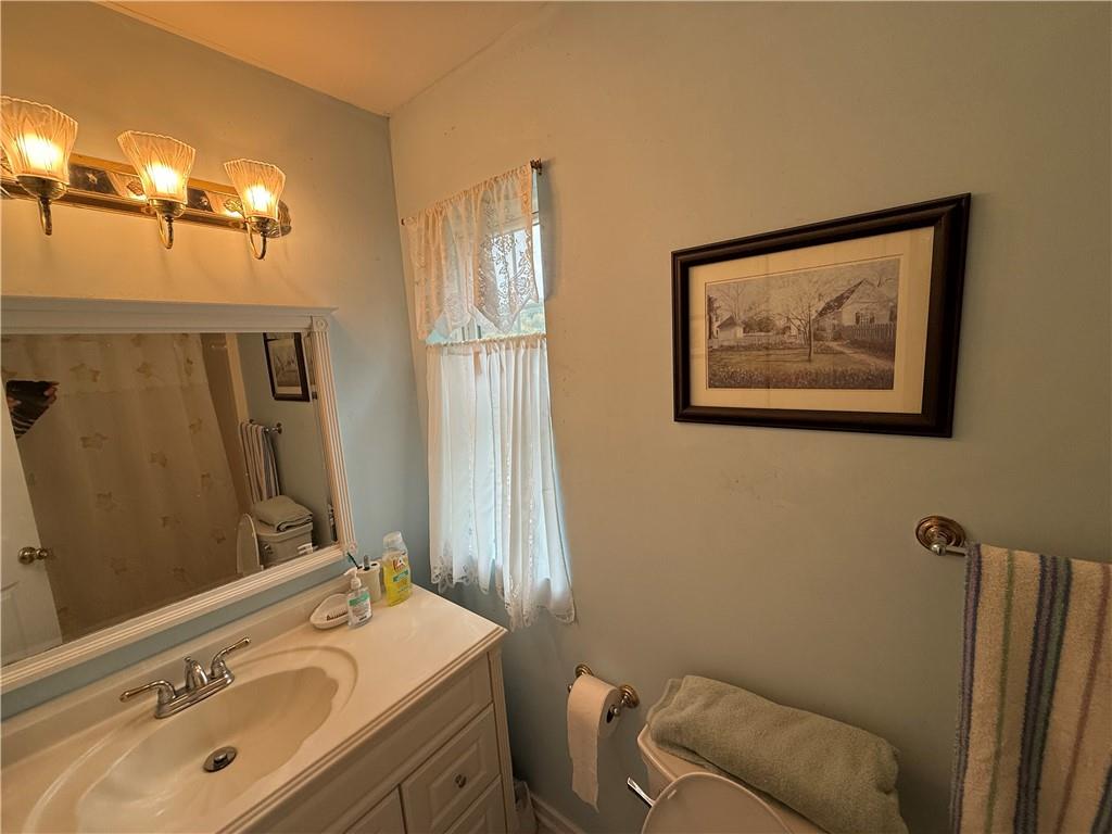 111 Fulton Lane Indiana, PA 15701 - Photo 10 of 20 a bathroom with a sink mirror and toilet