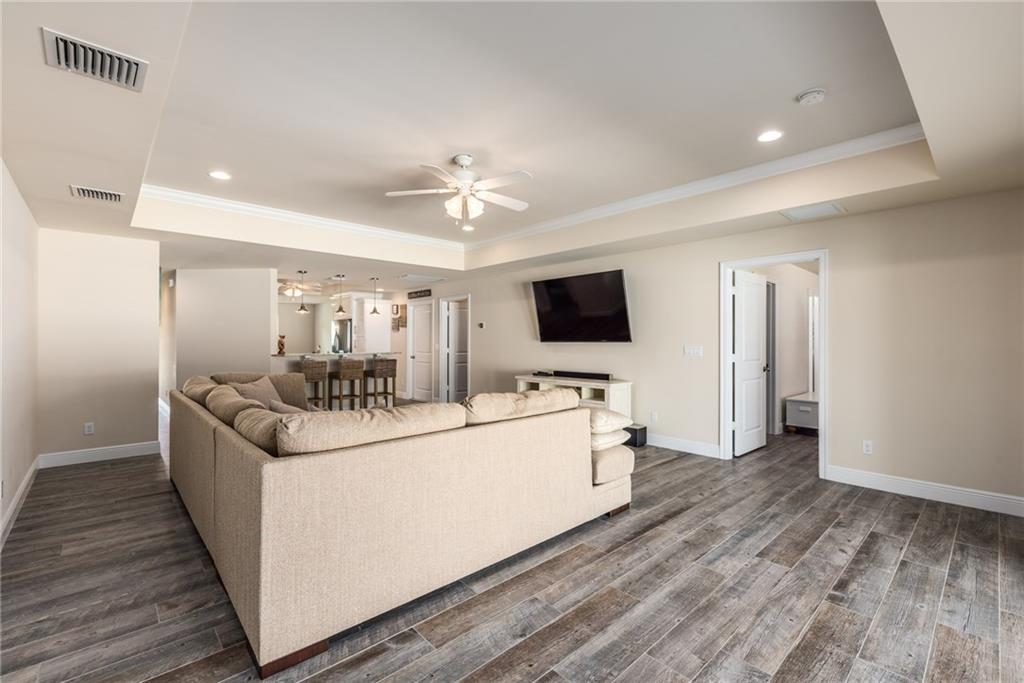 4833 Southeast Pilot Way Stuart, FL 34997 - Photo 13 of 37 a living room with furniture and a flat screen tv