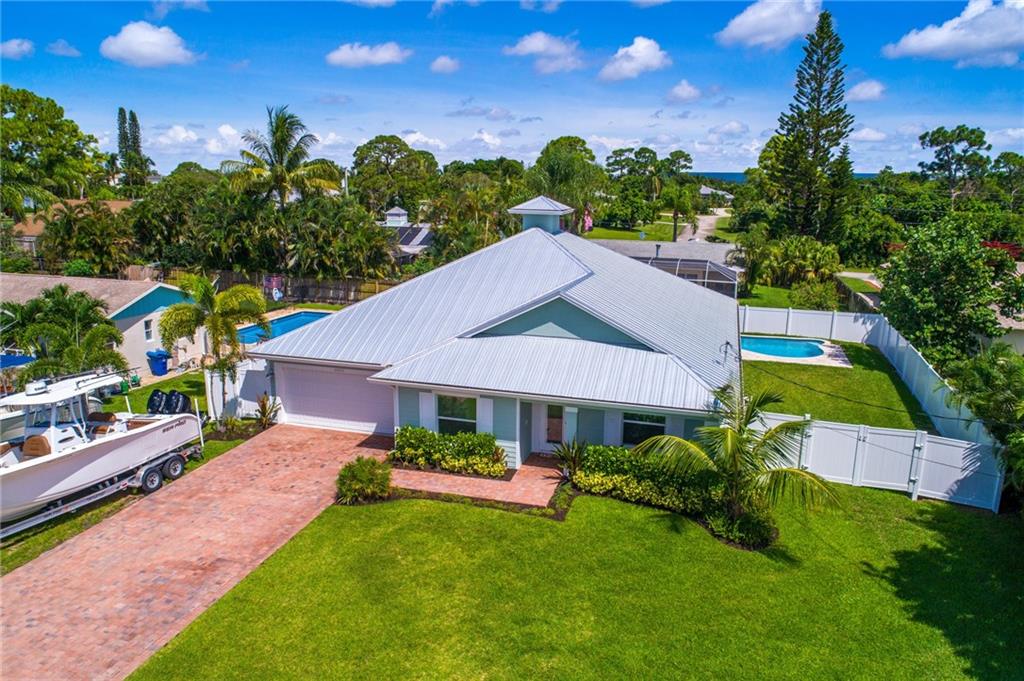 4833 Southeast Pilot Way Stuart, FL 34997 - Photo 28 of 37 a aerial view of a house with swimming pool garden and patio