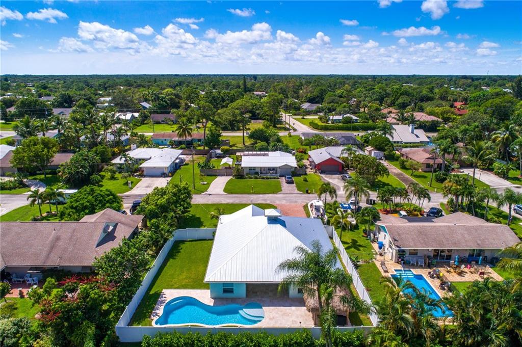 4833 Southeast Pilot Way Stuart, FL 34997 - Photo 30 of 37 an aerial view of residential houses with outdoor space and street view