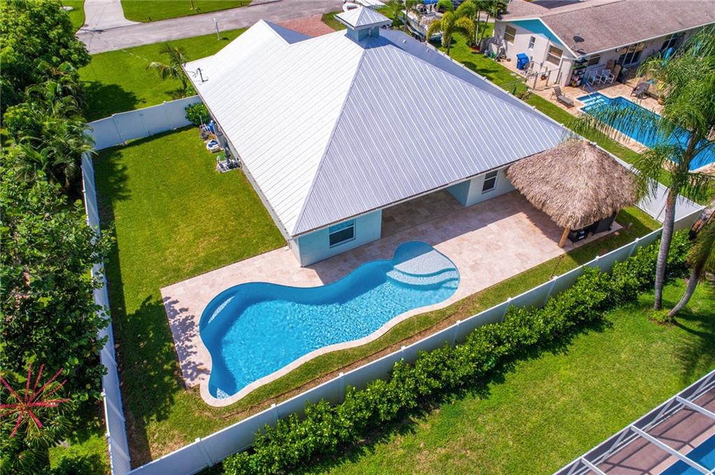 4833 Southeast Pilot Way Stuart, FL 34997 - Photo 3 of 37 an aerial view of a backyard