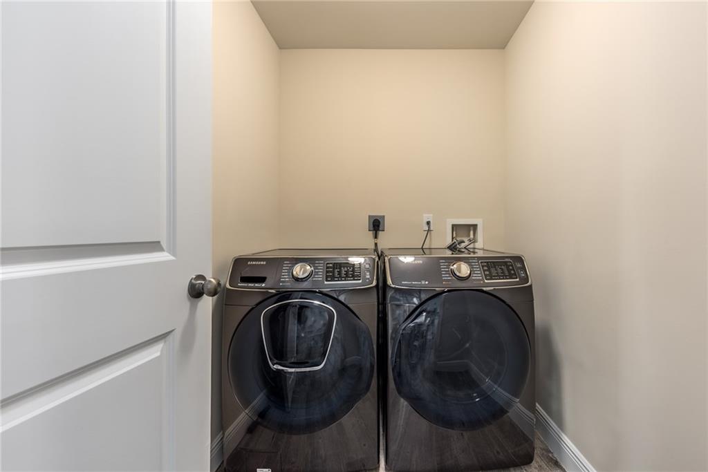 4833 Southeast Pilot Way Stuart, FL 34997 - Photo 34 of 37 a utility room with dryer and washer