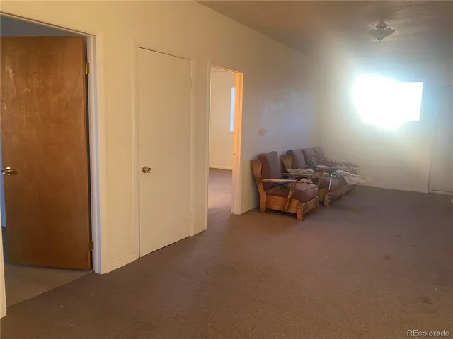 a view of a backyard with sitting area