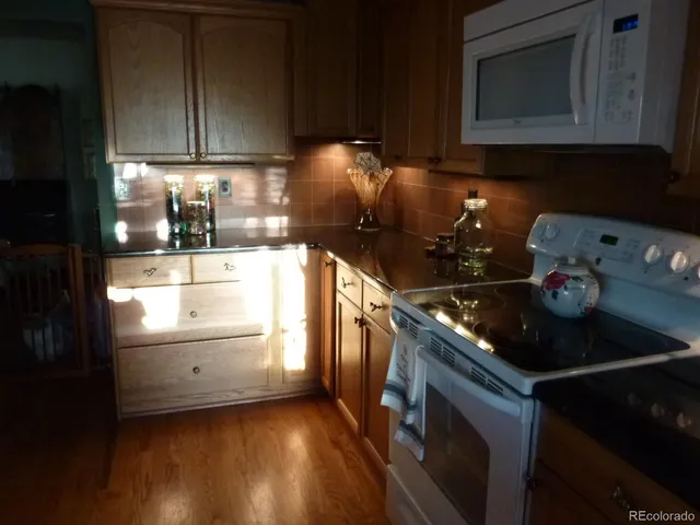 a kitchen with a stove and a microwave