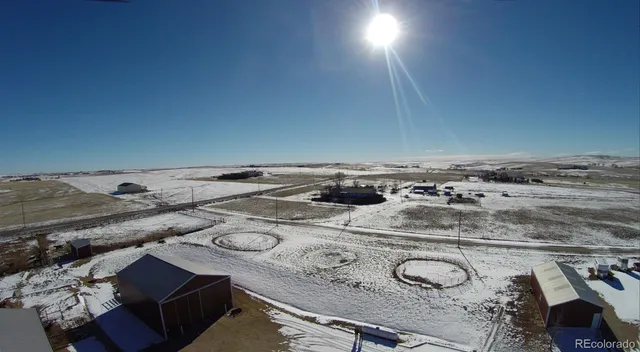 an outdoor space with furniture and mountain view