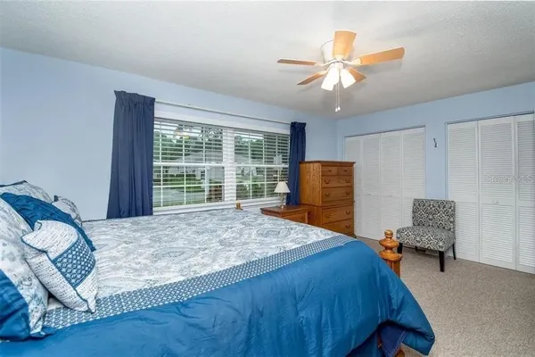 a bedroom with a bed and window
