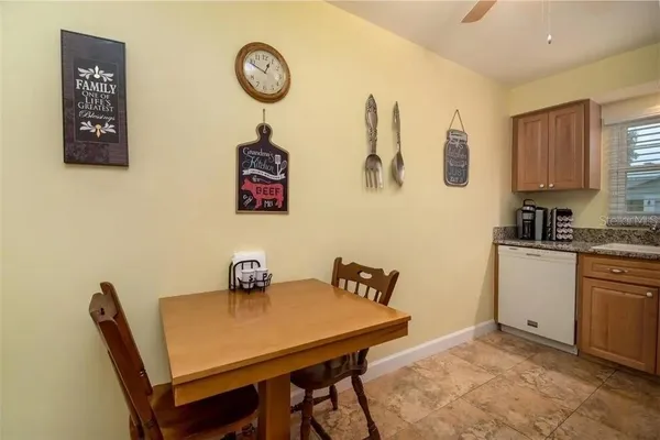 a view of a kitchen with dining table and chairs