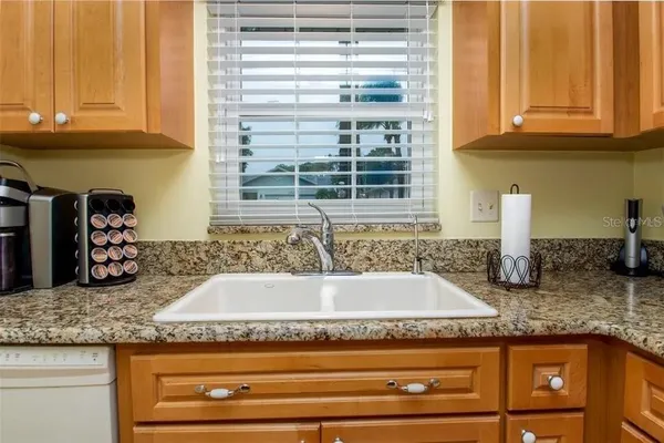 a bathroom with granite countertop a sink and a granite counter tops