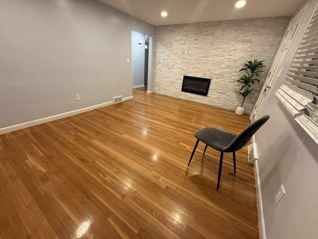 a backyard of a house with table and chairs