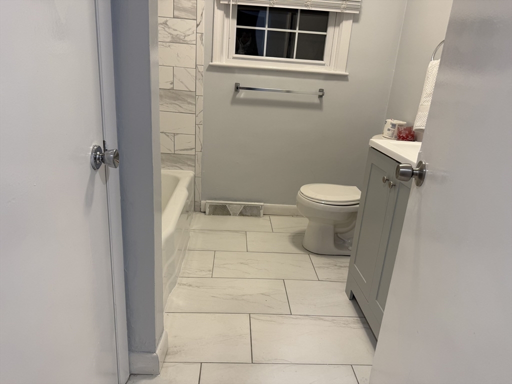 7 Champlain Road, Unit 1 Salem, MA 01970 - Photo 9 of 11 a bathroom with a toilet and a shower