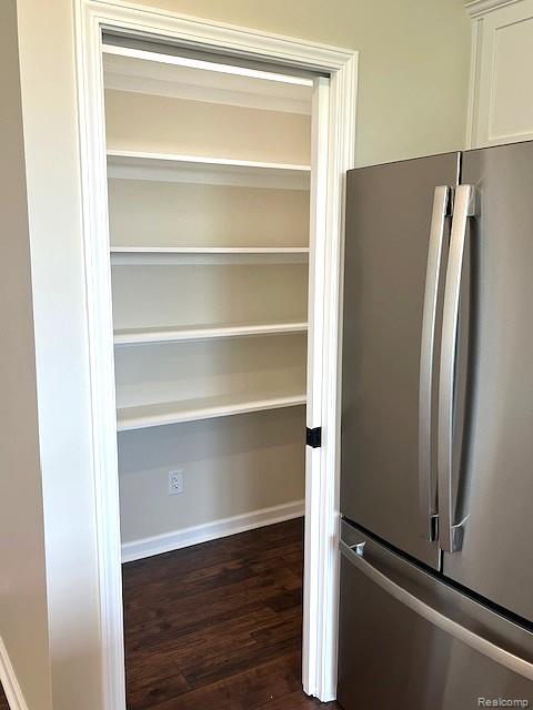 2670 Riley Center Road Memphis, MI 48041 - Photo 9 of 24 Pantry with multiple shelves, wood-finish flooring, and crown molding trim