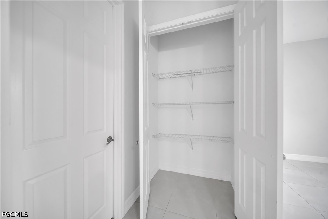 3509 38th Street Southwest Lehigh Acres, FL 33976 - Photo 29 of 47 a view of an empty walk in closet