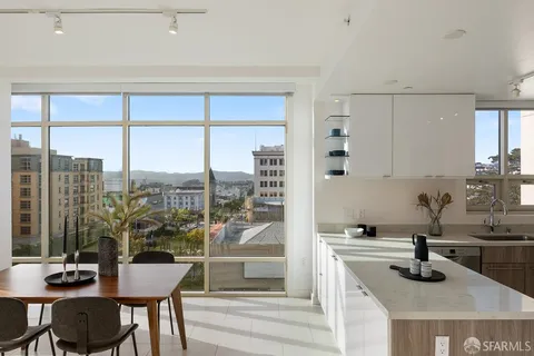 a kitchen with a table chairs and a stove