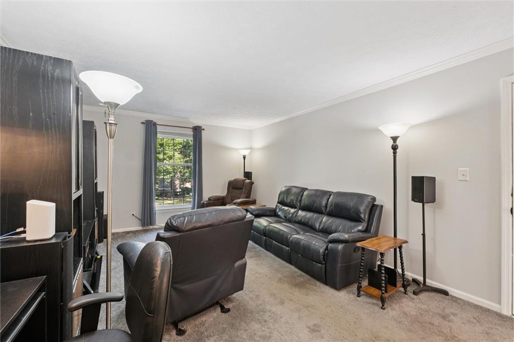 6700 Roswell Road, Unit 31B Atlanta, GA 30328 - Photo 13 of 32 a living room with furniture and a window