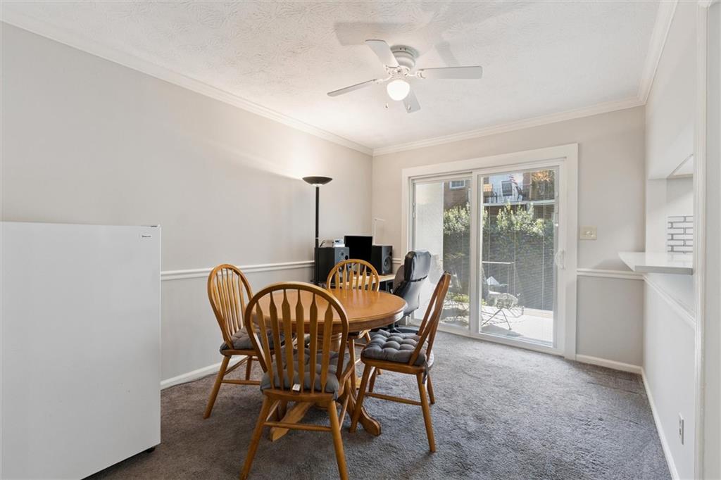 6700 Roswell Road, Unit 31B Atlanta, GA 30328 - Photo 14 of 32 a dining room with furniture and window