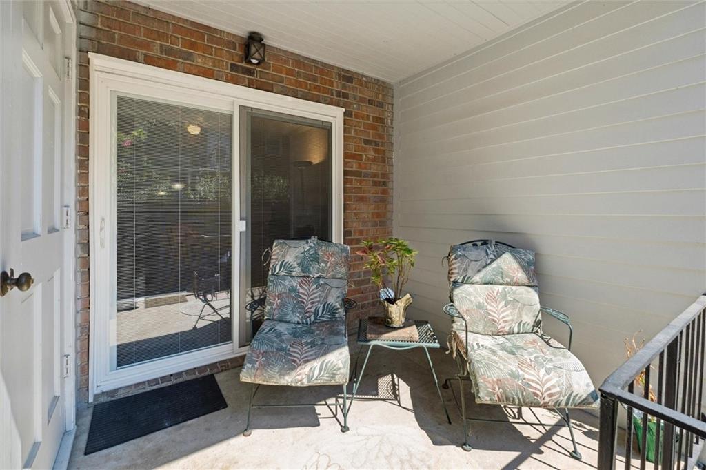 6700 Roswell Road, Unit 31B Atlanta, GA 30328 - Photo 22 of 32 a room with furniture and a gate