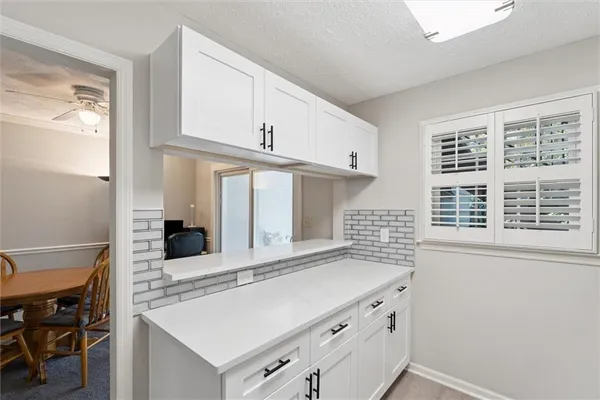 a kitchen with a stove and a refrigerator