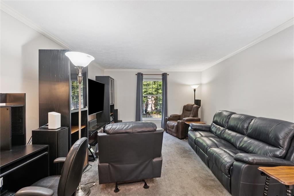 6700 Roswell Road, Unit 31B Atlanta, GA 30328 - Photo 10 of 32 a living room with furniture