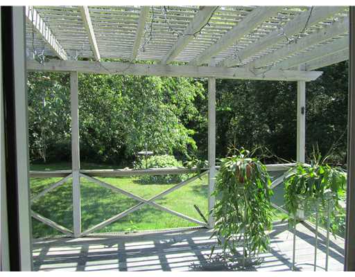 70 Pierce Road North Kingstown, RI 02874 - Photo 4 of 6 Yard/Garden. Oversized deck with arbor overlooking serene rear yard (3 bed septic is in front)