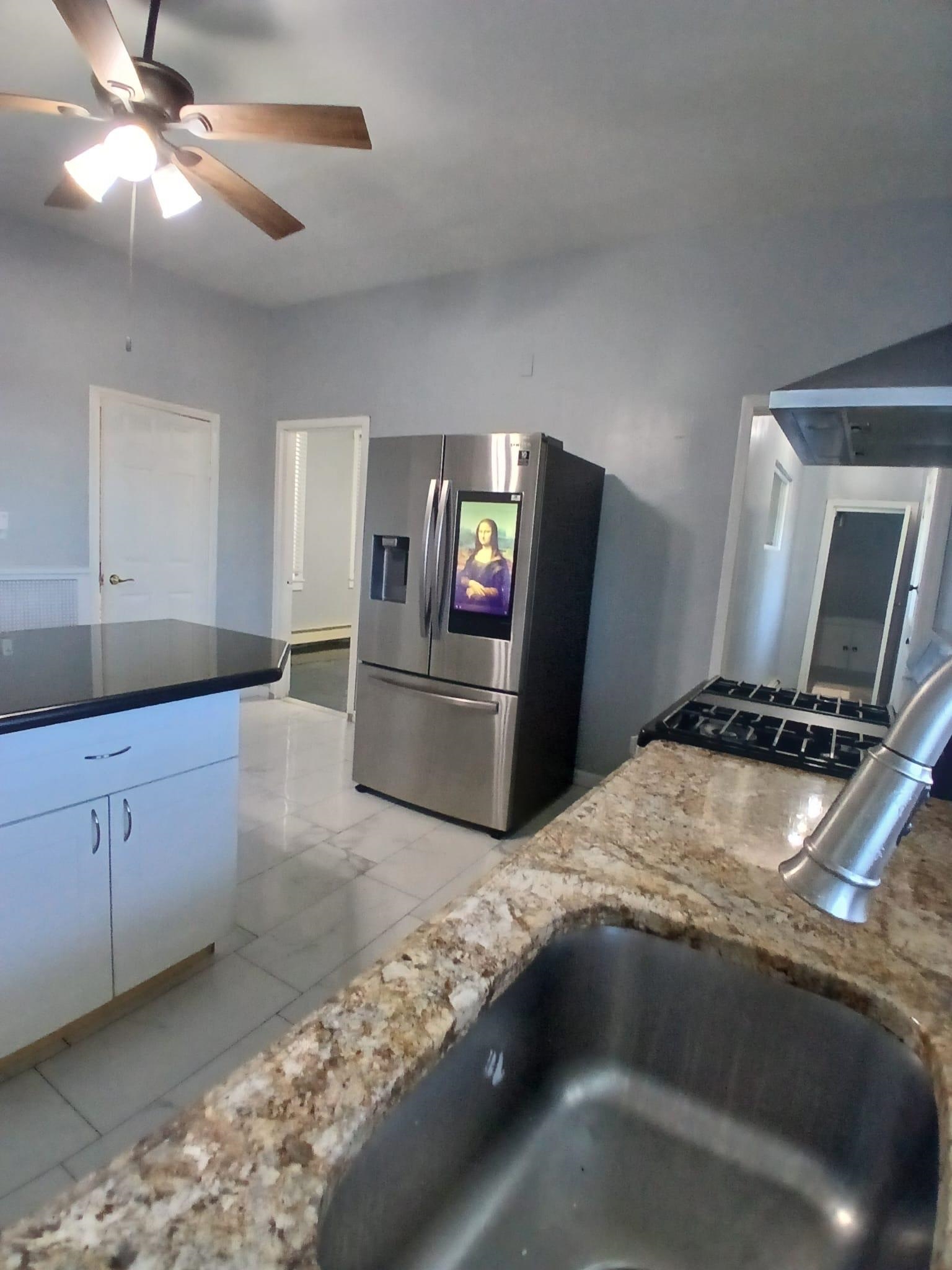 1212 89th Street North Bergen, NJ 07047 - Photo 1 of 41 a kitchen with granite countertop a stove and a sink