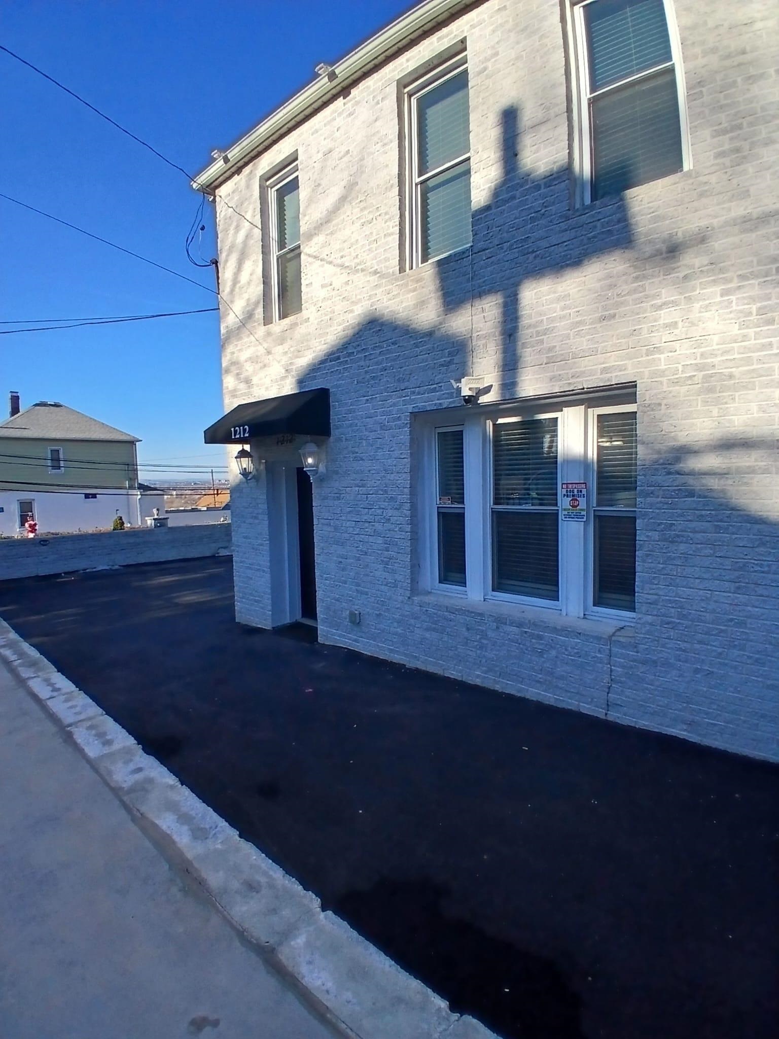 1212 89th Street North Bergen, NJ 07047 - Photo 19 of 41 a view of a building with many windows