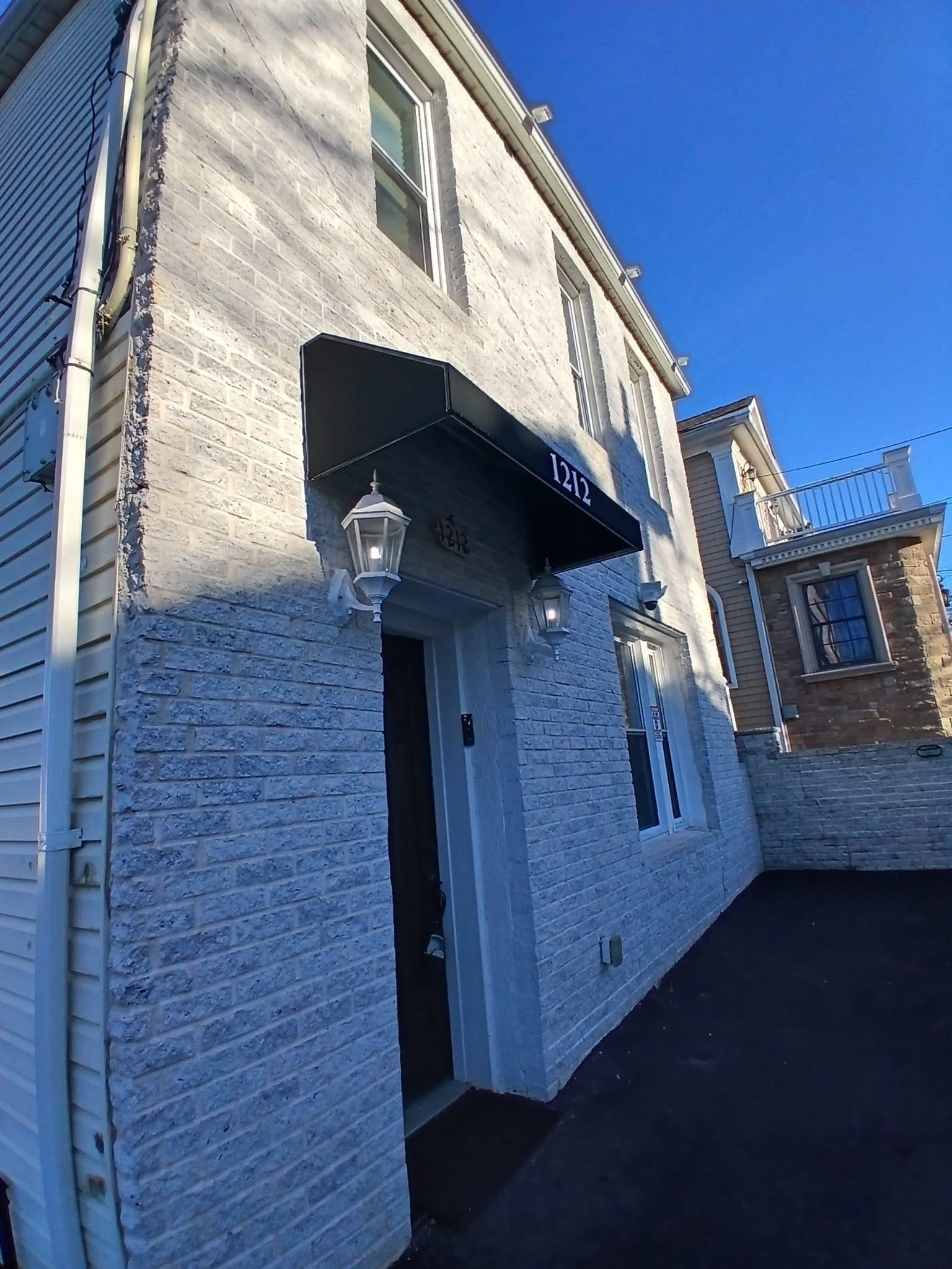 1212 89th Street North Bergen, NJ 07047 - Photo 20 of 41 a view of a house with a door